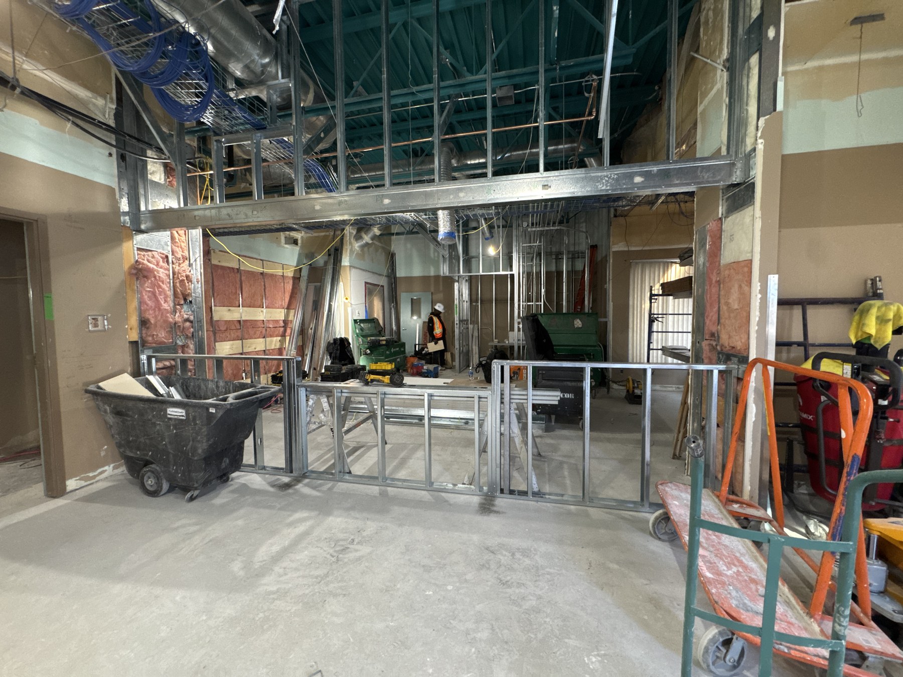 Steel stud framing and overhead services during construction at Abbotsford Mental Health Center