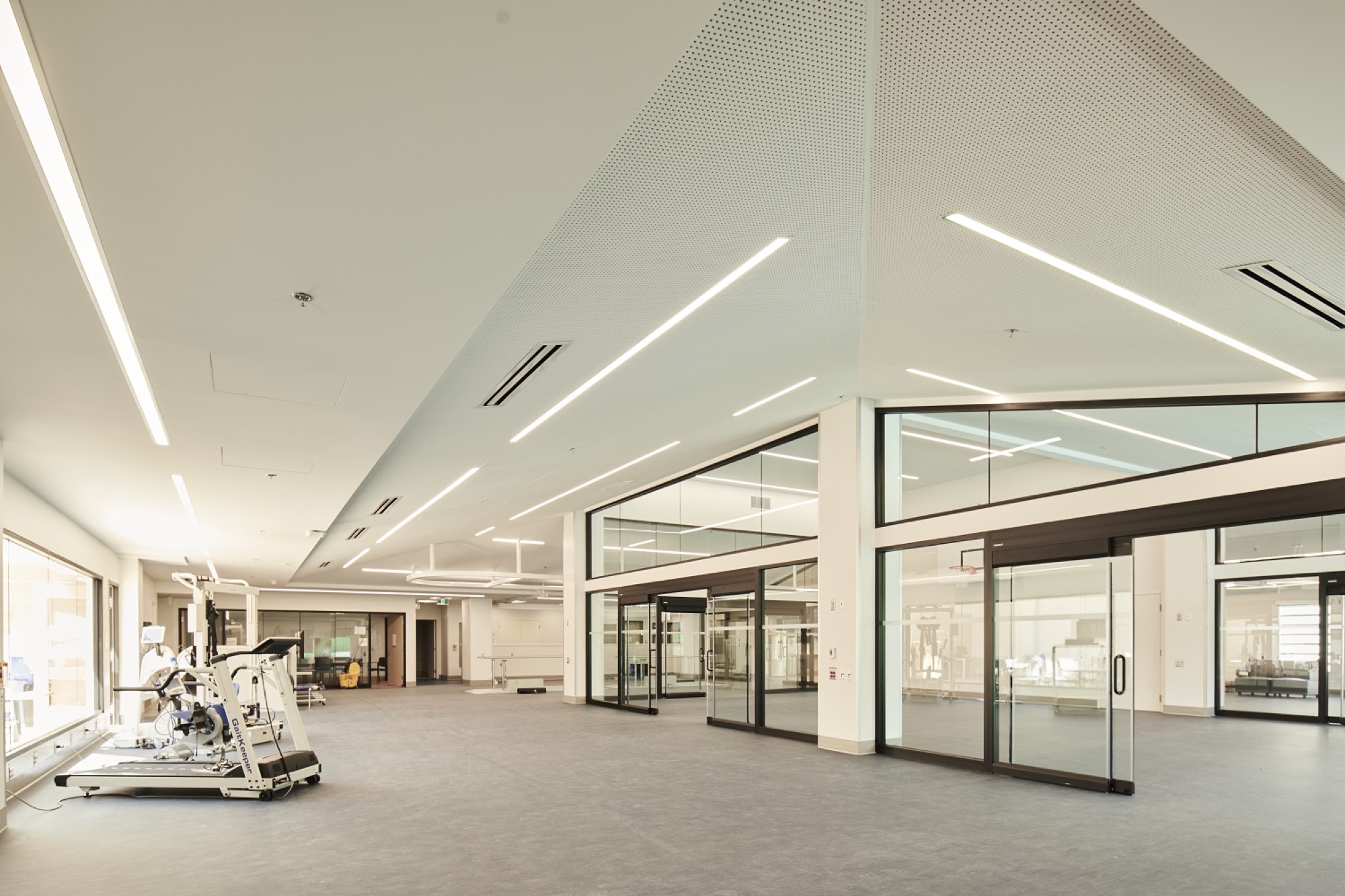 Bright gym interior with detailed ceiling panels at BC Children’s Hospital