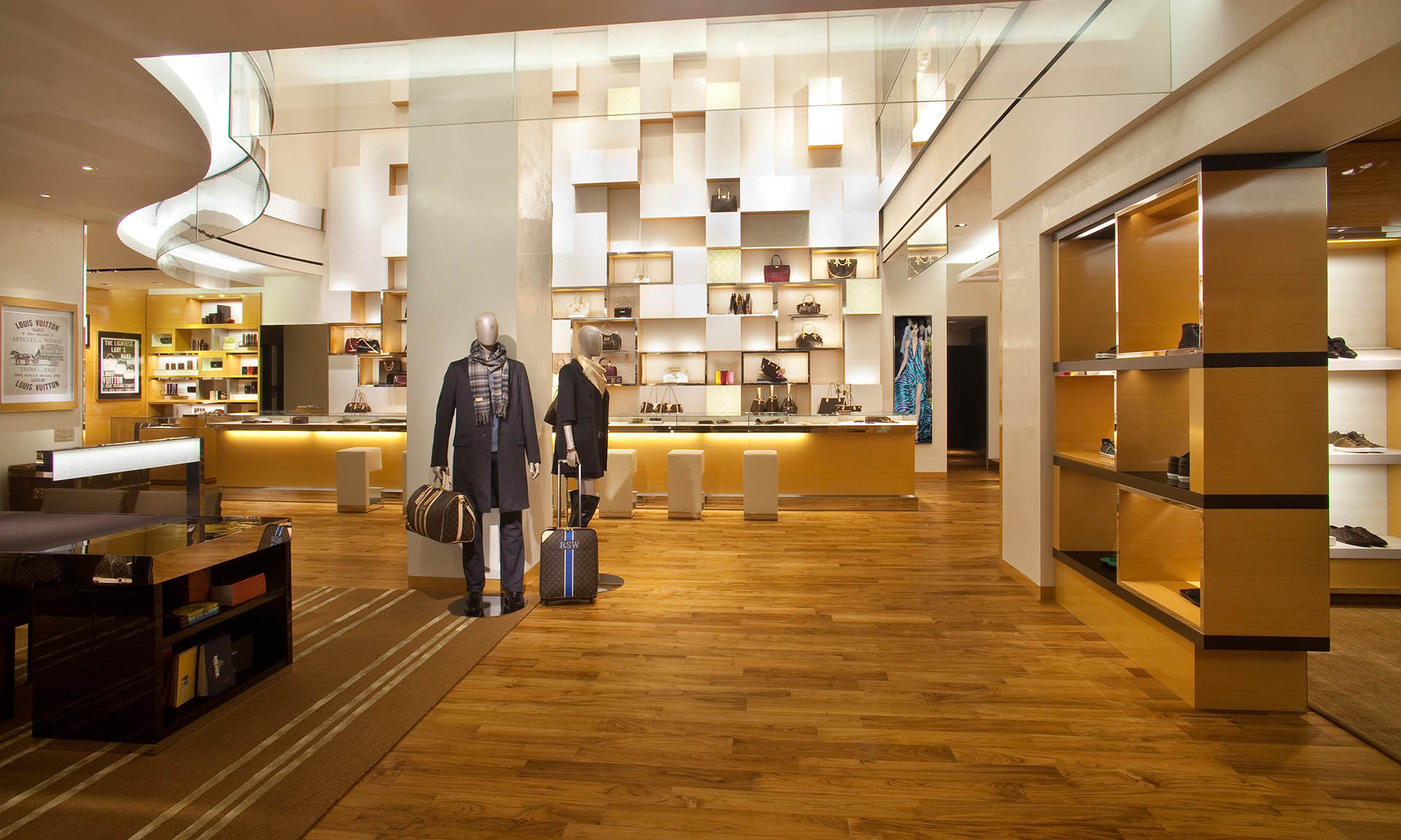 Finished Louis Vuitton Fairmont retail interior with an open floor and layered display walls