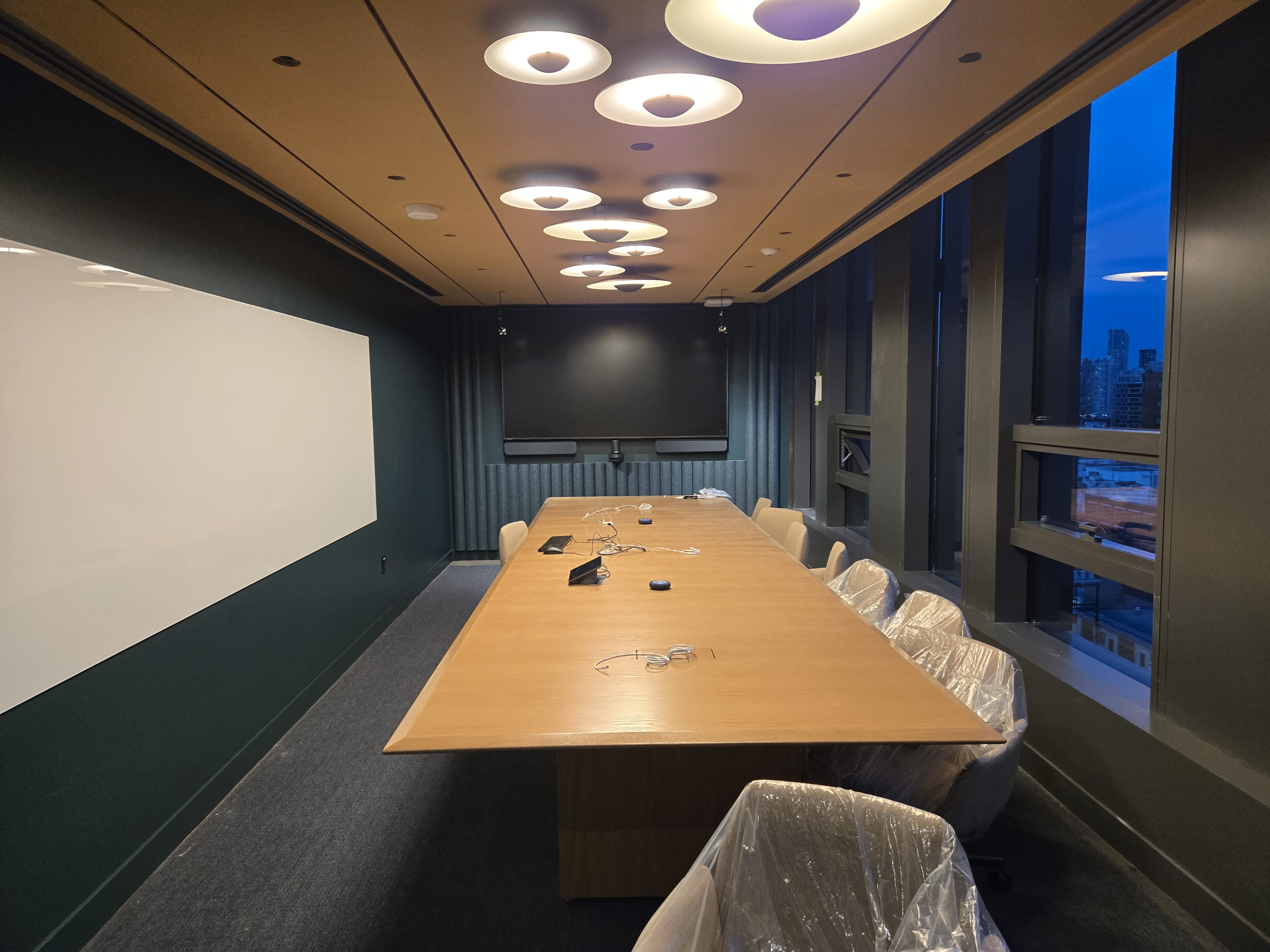 Netflix meeting room with a detailed ceiling and upholstered wall panels