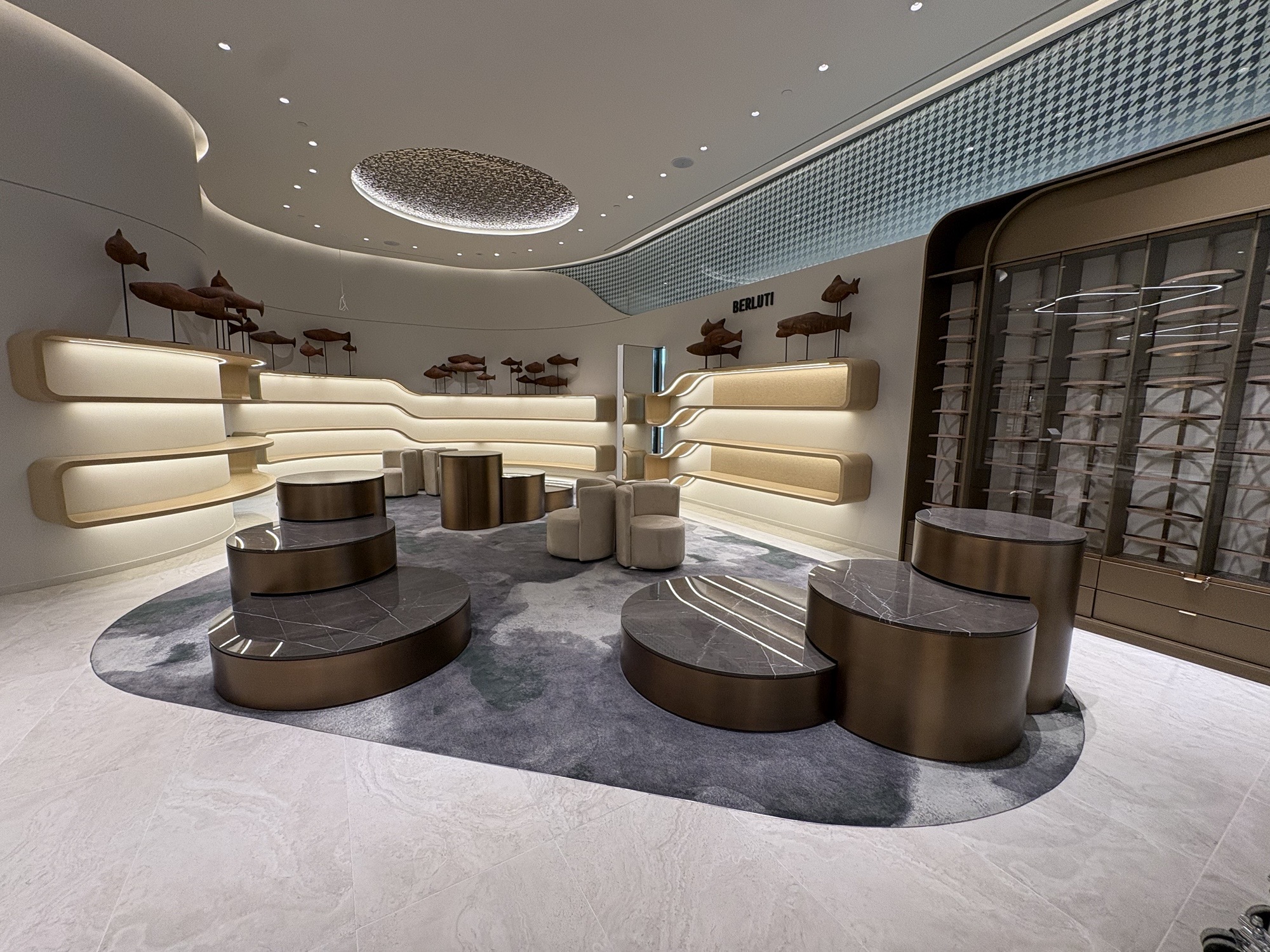 Harry Rosen · Oakridge Park · Footwear area with curved walls and illuminated shelving
