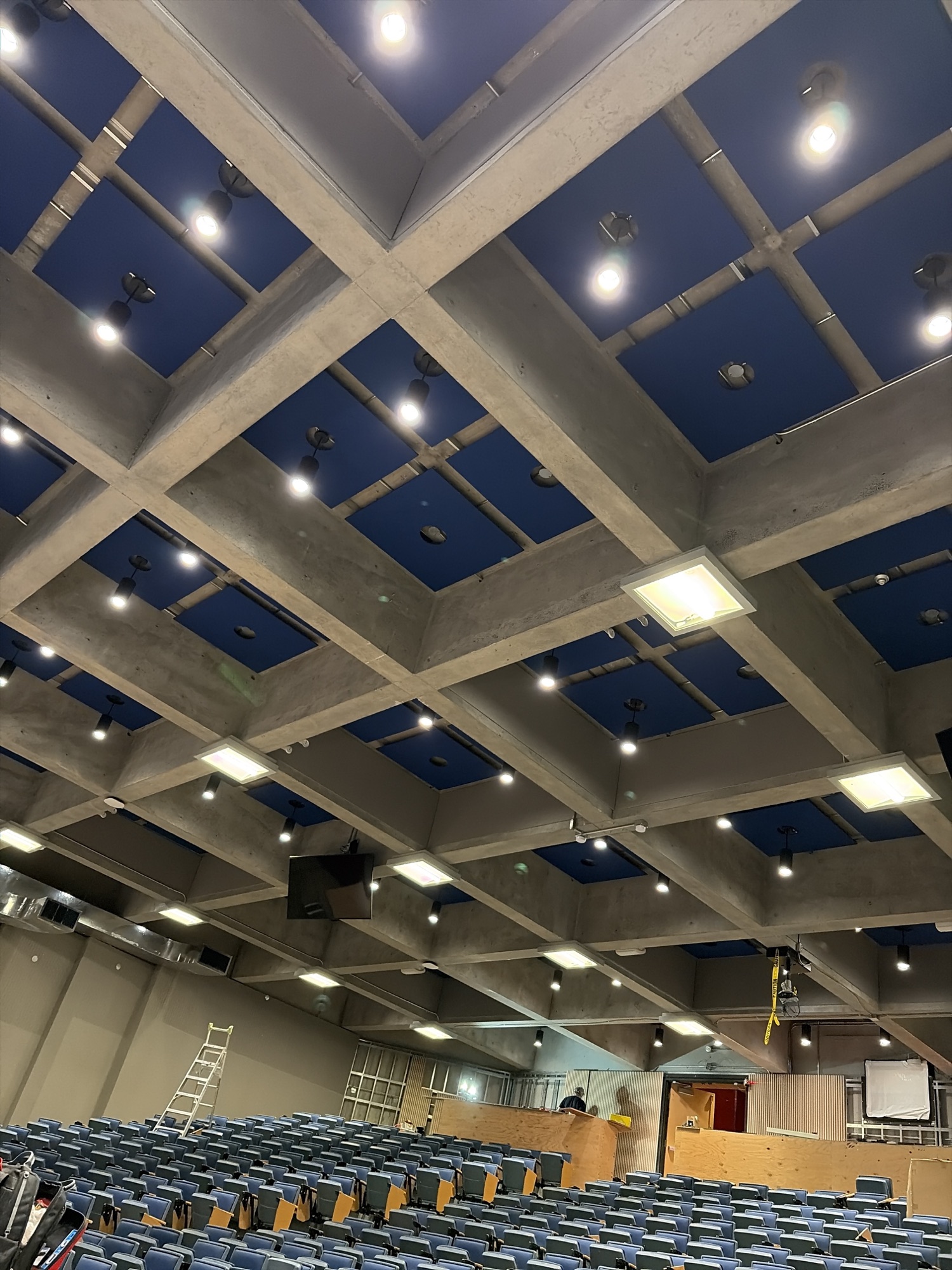 Blue inset ceiling panels and lighting above the auditorium seating at SFU Images Theatre