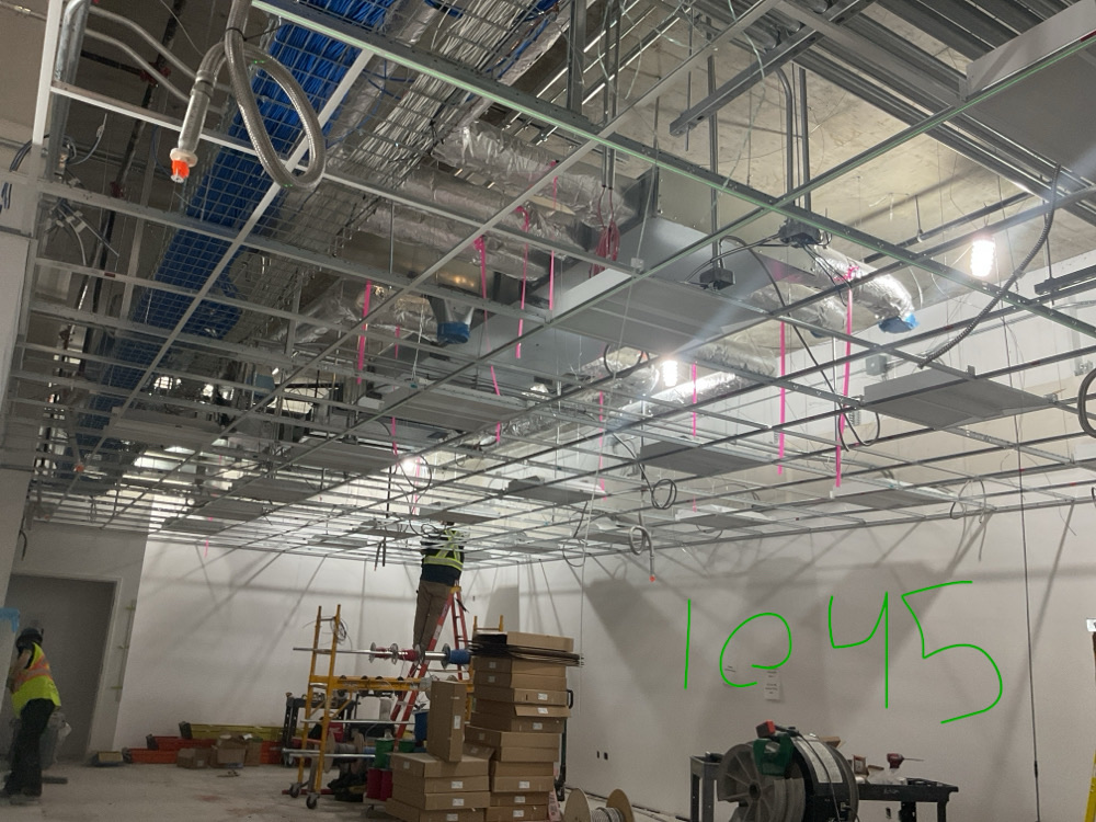 Ceiling framing and services during construction at Vancouver DTES UPCC