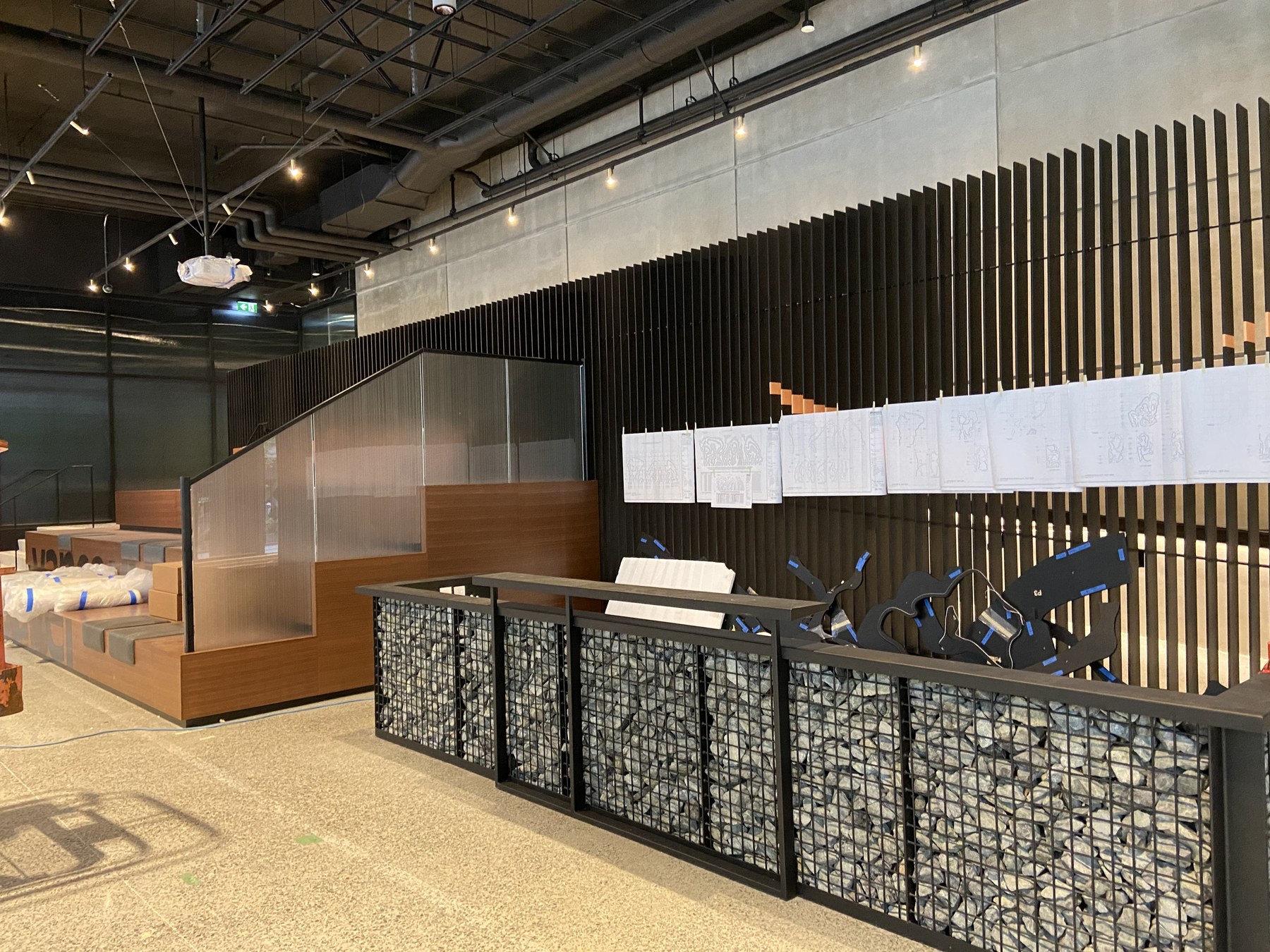 Slatted feature wall and metal stair enclosure at YVR14 / YVR21 (The Post)